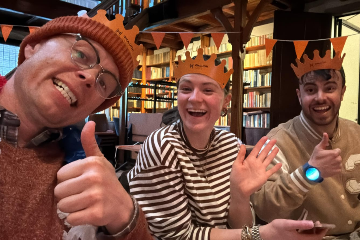 People smiling at camera during King's Day Bingo